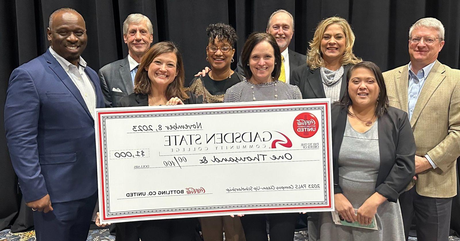 Pictured from left are Andy Britton, director of Public Affairs and Communications for Coca-Cola UNITED; Vanessa Cothran, a recent graduate who spearheaded the Don’t Drop It on Alabama project; Lynn Patterson, director of Student Activities; David Patterson, vice chancellor of Adult Education, Special Projects and System Initiatives for the Alabama Community College System; Misti Morgan, administrative assistant in Student Services; Angela Tillis, an advisor in  Student Support Services at Gadsden State; Jennifer Buchanan, administrative assistant in Student Services; Spencer Ryan, executive vice president of Alabama PALS; and Ricky Tillis, director of Gadsden State’s Valley Street Campus.